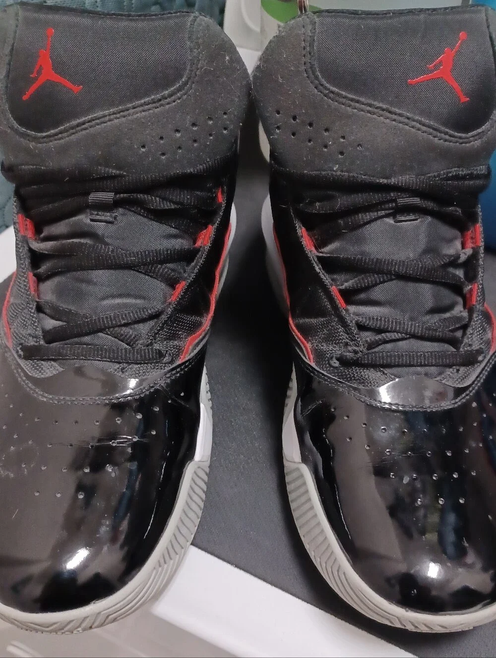 -- Air Jordan Men’s Black and Red High-Top Sneakers Size 11.5